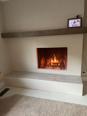 New look in this fireplace new tile,mantle and paint!!