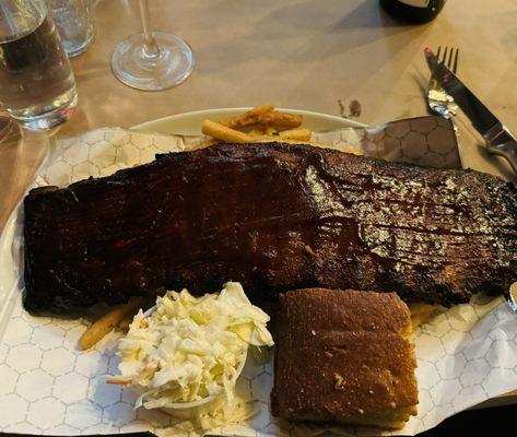 Ribs with crunchy fries, coleslaw and cornbread.
