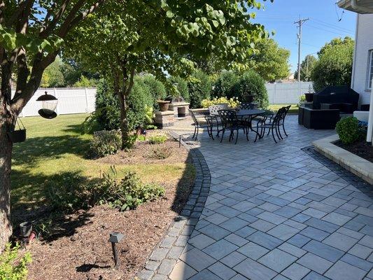 outdoor patio with paver installation. Landscape lighting service.