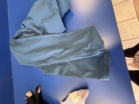 Torn up clothing from a dryer.