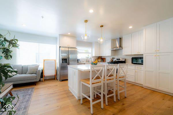 uxury kitchen remodel in El Segundo by Rona Home Remodeling: white shaker cabinets, matte gold fixtures.