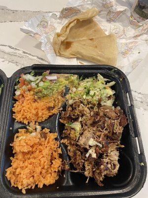 My carnitas plate with pork carnitas, guacamole, rice and heated wrap on the idea. It as a lot neater but I tiled the box side ways .