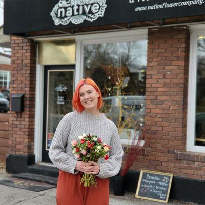 Owner Morgan Simkins, displaying locally grown Spring anemones