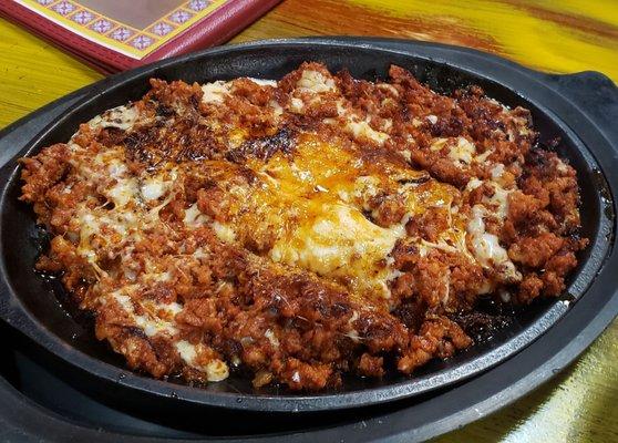 Queso fundido con chorizo ($10.75). Melted chihuahua cheese comes with choice of corn/flour tortillas