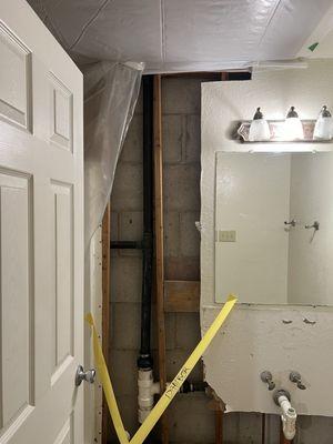 They installed a ceiling cover due to recent rainfall and removed the sink and floor for inspection.