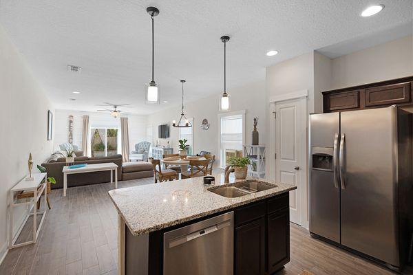 An open concept first floor plan is still very popular with buyers. Make it flow by using neutral floors and walls.