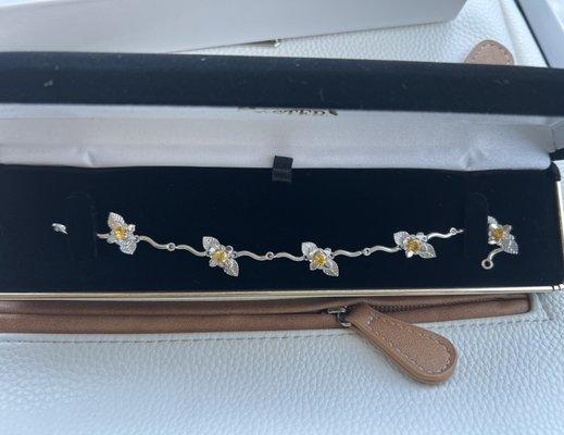 White gold with yellow sapphires. This bracelet is a custom piece of jewelry La Masters made for my wife.