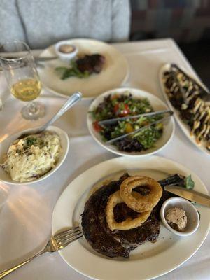 Dry aged Ribeye, garlic mashed, crispy Brussels, and market salad