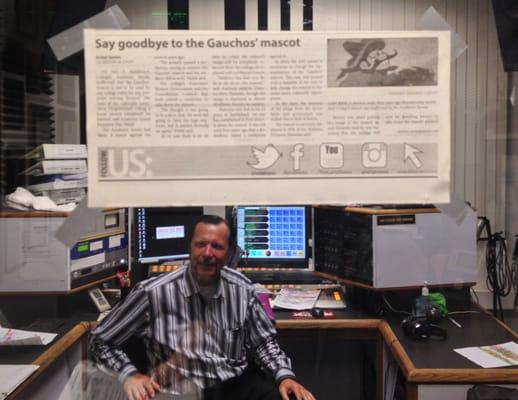 One of the KSBR deejays in-studio with Saddleback College news to talk about.