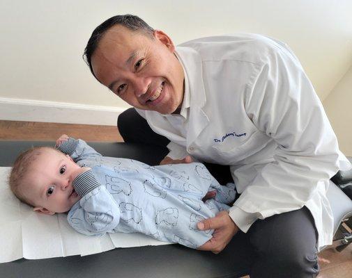 Dr. Johnny Truong and Aiden Rose after his first adjustment!