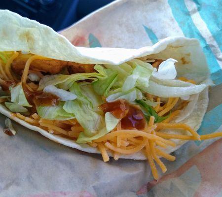 Spicy potato taco with hot sauce