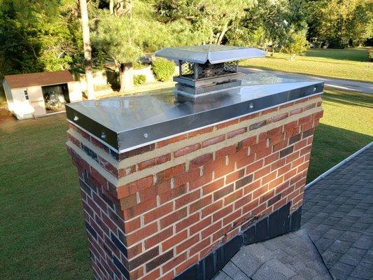 Custom chase cover to cover top of chimney and house wood stove termination. Mortar joint repairs and corbel resurfacings.