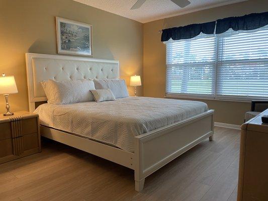Master bedroom of one of our units with a king size bed.