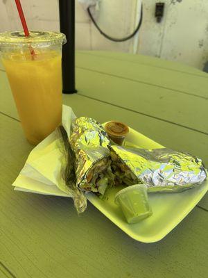 Veggie burrito and fresh mango drink