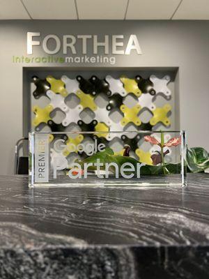 Forthea's Premier Google Partner plaque.