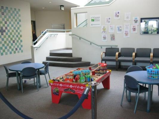 The main lobby at CHC with adult and child sized furniture, books, toys and more.