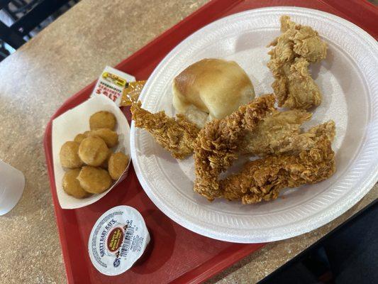 #1 4 chicken tenders with corn nuggets and a roll.