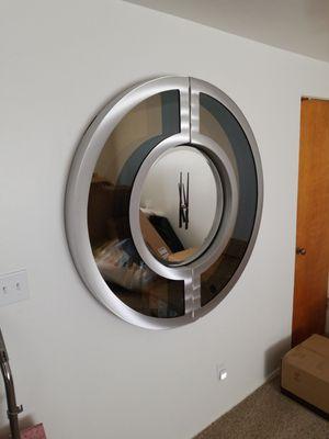 Decorative wall clock assembled and installed.