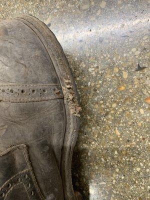 Boot with chainsaw damage