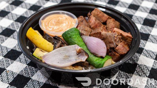 Hibachi steak, grilled vegetables, and "yum yum" sauce over jasmine rice.