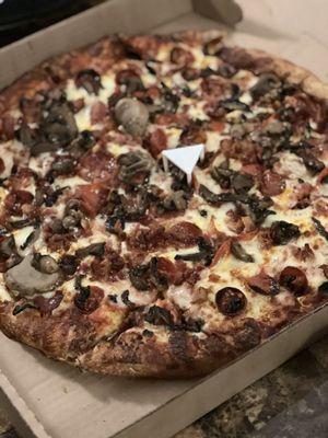 Cheese, pep, bacon and mushroom pizza