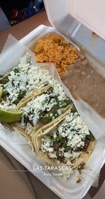 3 fajita tacos with rice and beans plate