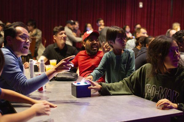 A crowd of teams playing 100 League Live! at Two Bit Circus in Los Angeles.