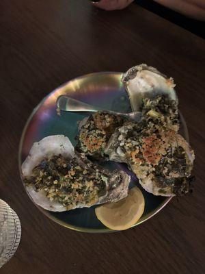 Rockafella Oysters appetizer with creamy collard greens and garlic Parmesan breadcrumbs. 10/10