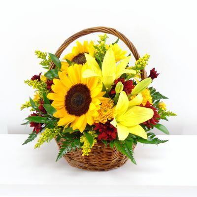 Take in the beauty of the season with basket of sunflowers, lilies,daisies, mums and statice.