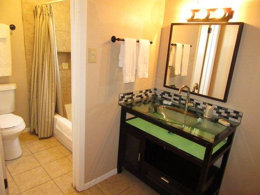 A newly remodeled bathroom at El Patio Inn, with one of our unique vanities.