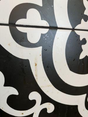 This is a picture of the Schmutz on the wall in the first booth right across from the door you enter in.