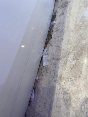 A lot of Fake nail cuttings on the floor.