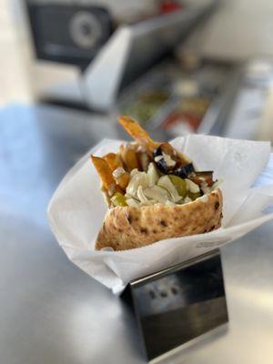 Pita sandwich called 'Sabich'. It have hard void egg, eggplant, French fries and all the salads as option.