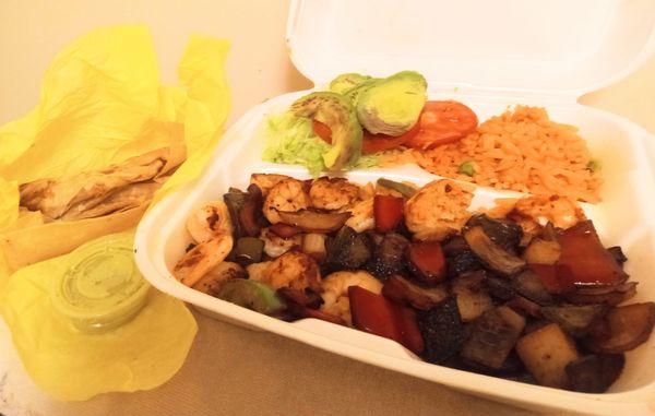 Flour tortilla/shrimp fajita comes w/ Spanish rice, avocados, tomato slices, & lots of shredded green lettuce