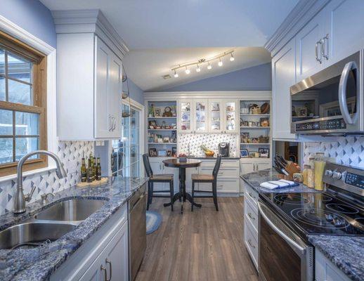 Light accents color in this beautiful kitchen renovation we completed with Quality Design & Construction.