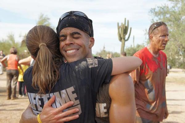 Celebration hug from one of my clients after running the Mad Mud Run in Scottsdale.