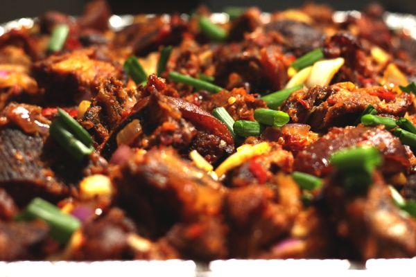 Asun ( Peppered smoked Goat Meat)