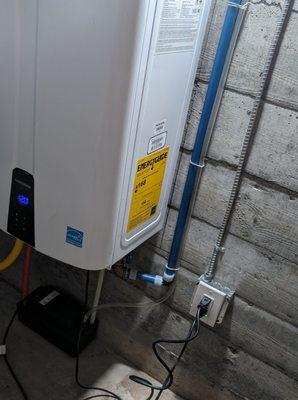 Outlet added for tankless water heater in root cellar
