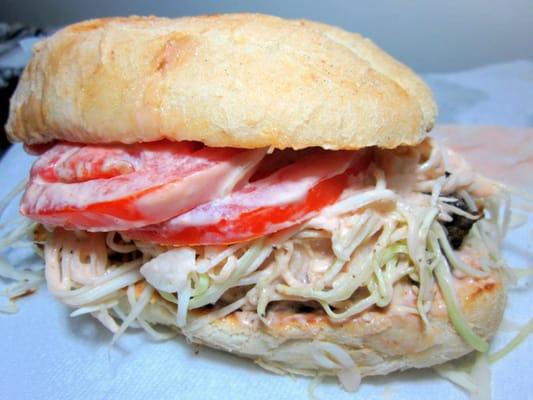 Chimichurri perfection! Tomato, crunchy cabbage in secret sauce, oregano beef patty. All in between a fluffy Pan de Agua bun.