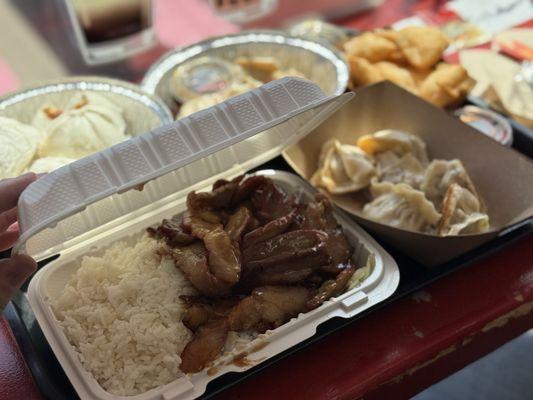 Pork and rice, bbq buns back left, pork dumplings front right, chicken dumplings behind and the crab rangoon back right