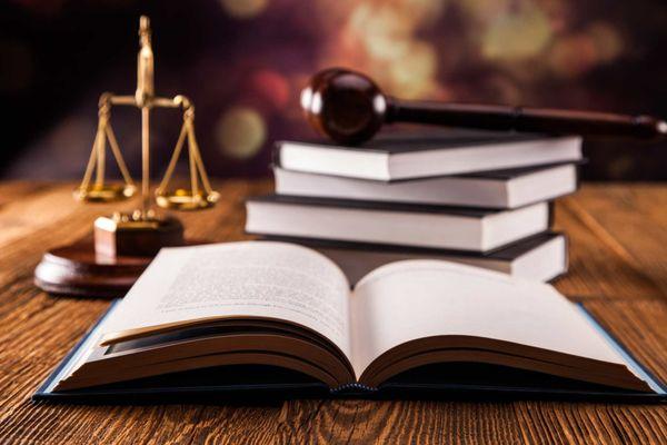 Books with scales & gavel in the background