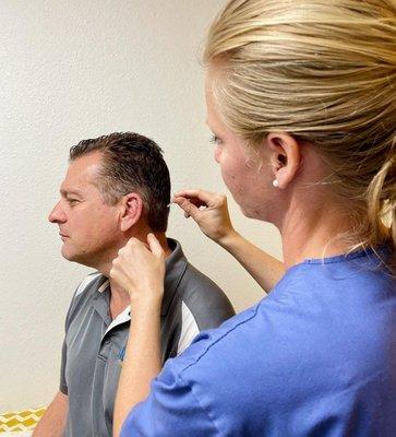 Director Howard Flamm receiving acupuncture.