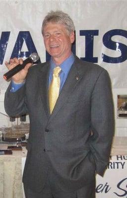 Mr. Suarez, awarding public service recipients in his role as President of the Kiwanis Club of Huntington.