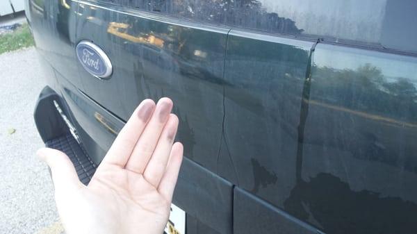 Black film covering back of car after car wash # 1