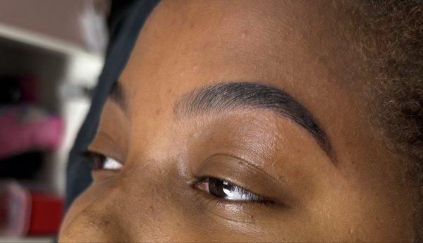 Brow lamination, tint, and waxing combo.