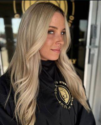 Customized blonde lived in color with blowdry style