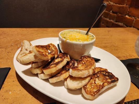 Delicious spinach artichoke dip with crusty bread