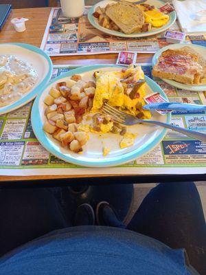 Western omelet, home fries, sausage gravy over biscuits