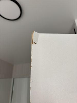 Broken piece at top of bathroom door