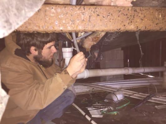 This is one of our trusted service techs working under home.